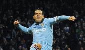 Tevez double sends Man City atop table