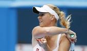 Glam girls Wozniacki, Sharapova record easy wins