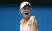 Gritty Wozniacki sees off Schiavone