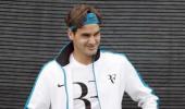 Federer overcomes feisty Portuguese