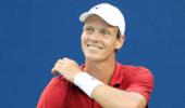 Berdych saves match points to advance in Halle