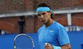 Nadal back in groove on grass, Murray labours