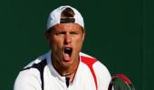 Hewitt soldiers on, Tomic claims biggest win