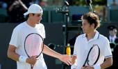 Photos: Isner-Mahut Wimbledon rematch a damp squib