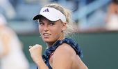 Wozniacki battles through, Clijsters out injured