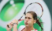 Petkovic upsets Jankovic, Clijsters survives