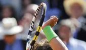 Nadal crushes Baghdatis as Federer scrapes through