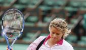 Images: Clijsters knocked out, Soderling advances