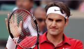 Images: Federer on fire, Schiavone survives