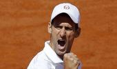 Djokovic battles through to round 4