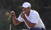 Golf: Tiger Woods takes lead at Australian Open