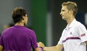 Germany's Mayer stuns Nadal, Murray marches on