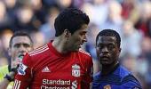 Man U's Evra claims of racist abuse by Suarez