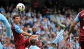 Free-scoring Man City take top spot from United