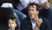 First Look: British PM Cameron at English Premier League match