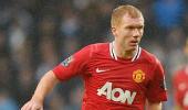 Ferguson scoffs at talk of Scholes retirement