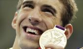 Phelps defies belief to become history-maker