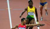 PHOTOS: US breaks 27-year-old record in women's 4x100