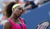 Federer, Serena march on in US Open heat