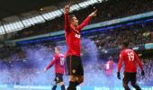 Photos: Van Persie scores on Manchester derby debut