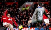 Man United win seven-goal thriller while City lose