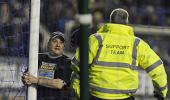 Fan handcuffs himself to goalpost during Man City game