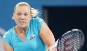 Clijsters eases into semis, Kanepi upsets Petkovic