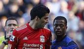 Suarez issues limited apology over racial slur