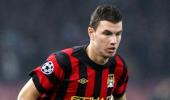 Dzeko heads gritty Man City clear at top