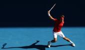 Federer floors Del Potro to enter semis