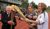 Bannister carries Olympic torch at site of famous mile