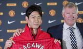 Kagawa happy to handle Man United pressure