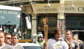 First Look: Big B carries Olympic flame in London