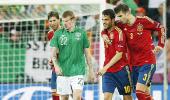 PHOTOS: Spain march on as Irish sing in rain