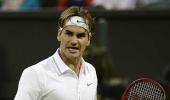 Federer survives five-set thriller to reach last 16