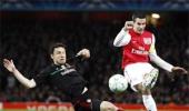 AC Milan survive Arsenal onslaught to progress