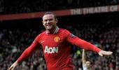 Rooney goals lift Man United top after City lose