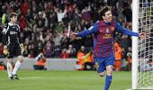 Record man Messi helps Barca close gap on Real