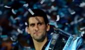 Djokovic grinds down Federer to win World Tour Finals