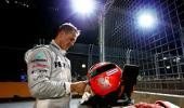 Schumacher reprimanded for impeding HRT drivers