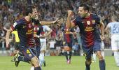 La Liga: Xavi, Messi score late to help Barca stay on top