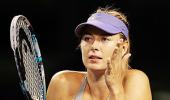 Erroneous Sharapova stutters into pre-quarters