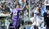 Fiorentina hold Milan in fight for Champions League place