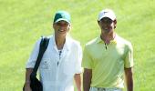 Wozniacki plays caddy to boyfriend McIlroy at Augusta!