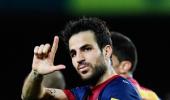 Late Fabregas goal moves Barca closer to title