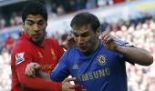 Suarez shows appetite for trouble, bites Chelsea defender