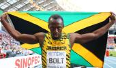 Bolt completes sprint double with ease at world athletics