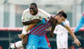 Balotelli helps Milan end chaotic week with win at Catania