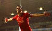 Suarez signs long-term contract with Liverpool