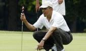 In a first, Obama playing golf with Tiger Woods